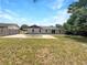 The backyard features a large patio and plenty of green space at 52 Hydrangea Ln, Debary, FL 32713