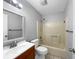 Bright bathroom with a shower-tub combo and a single sink vanity with a wood cabinet at 52 Hydrangea Ln, Debary, FL 32713
