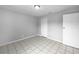 An empty bedroom with tile floors, a closet, and bright natural light at 52 Hydrangea Ln, Debary, FL 32713