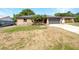 Charming single-story brick home with a well-maintained front yard and a two car garage at 52 Hydrangea Ln, Debary, FL 32713
