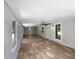 A spacious sunroom with tiled flooring, multiple ceiling fans, and many windows offering natural light at 52 Hydrangea Ln, Debary, FL 32713