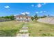 Large backyard features a stone path, patio with outdoor seating, and a privacy fence at 5431 White Heron Pl, Oviedo, FL 32765