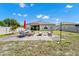A beautiful backyard features a paved patio with ample seating and mature trees at 5431 White Heron Pl, Oviedo, FL 32765