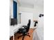 Bedroom featuring hardwood floors, a white desk, and a sloped ceiling at 5431 White Heron Pl, Oviedo, FL 32765