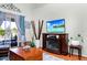 Living room featuring a fireplace and a view to the patio at 5431 White Heron Pl, Oviedo, FL 32765