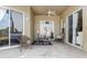 Enclosed patio featuring sliding glass doors, offering a versatile indoor-outdoor living space at 5431 White Heron Pl, Oviedo, FL 32765