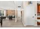 Inviting hallway leading to a spacious living room with elegant chandelier lighting and stylish decor at 555 Carey Way, Orlando, FL 32825