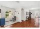 Hallway featuring hardwood floors, open space, and natural light at 555 Carey Way, Orlando, FL 32825
