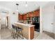 Modern kitchen with dark wood cabinets, stainless steel appliances, and a breakfast bar at 555 Carey Way, Orlando, FL 32825