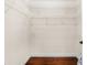 Spacious walk-in closet featuring white shelving and hardwood floors at 555 Carey Way, Orlando, FL 32825