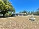 Classic one-story home with a traditional design, a beautiful fountain and a large lawn area at 6001 Beau Ln, Orlando, FL 32808