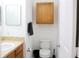Cozy bathroom features a vanity sink, toilet, and enclosed storage, creating a functional space at 6117 Metrowest Blvd # 106, Orlando, FL 32835