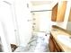 Bathroom with a tub and shower, and light wood vanity with white marbled floors at 6117 Metrowest Blvd # 106, Orlando, FL 32835
