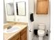 Half bathroom with a vanity sink and toilet at 6117 Metrowest Blvd # 106, Orlando, FL 32835