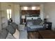Open-concept living room with couches, wood floors, and a kitchen with tile backsplash at 6117 Metrowest Blvd # 106, Orlando, FL 32835