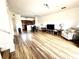 Spacious living room featuring wood-look flooring and an open floor plan concept at 6117 Metrowest Blvd # 106, Orlando, FL 32835