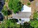 An aerial view shows the roof and surrounding greenery, offering a sense of privacy at 808 Denton Rd, Winter Park, FL 32792