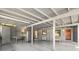 Spacious garage featuring gray walls and ceiling, with exposed beams and ample storage space at 808 Denton Rd, Winter Park, FL 32792