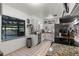 Bright kitchen featuring white cabinets, stainless steel appliances, and granite countertops at 808 Denton Rd, Winter Park, FL 32792