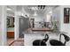 Bright kitchen featuring granite counters, white cabinets, modern appliances, and bar seating at 808 Denton Rd, Winter Park, FL 32792