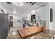 Bright kitchen featuring white cabinets, stainless steel appliances, and granite countertops at 808 Denton Rd, Winter Park, FL 32792
