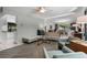 Bright living room featuring modern furniture, ceiling fan, and adjacent dining area with natural light at 808 Denton Rd, Winter Park, FL 32792