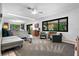 Open living room boasts abundant natural light, retro furniture, and an adjacent dining area at 808 Denton Rd, Winter Park, FL 32792