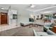 Cozy living room featuring retro furniture, sleek flooring, and an open layout at 808 Denton Rd, Winter Park, FL 32792