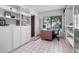 A home office features built-in shelving, a large window with natural light, and tile flooring at 808 Denton Rd, Winter Park, FL 32792