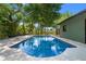 A private swimming pool with clear blue water, perfect for relaxation and recreation at 808 Denton Rd, Winter Park, FL 32792