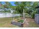 Outdoor garden bed on a green lawn with partial shade from mature trees at 808 Denton Rd, Winter Park, FL 32792
