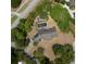 Aerial view of home showcasing a private backyard pool, mature landscaping, and surrounding neighborhood at 8735 Rancho Ct, Orlando, FL 32836