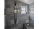 Modern bathroom showcasing a marble-tiled shower with a built-in bench and rainfall shower head at 8735 Rancho Ct, Orlando, FL 32836