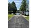 A community boat ramp provides access to the lake with mature trees on either side at 10715 Swallow Pt, Clermont, FL 34711