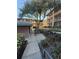 A community area featuring a picnic table, grill, and mature tree in a courtyard setting of an apartment complex at 128 Water Front Way # 300, Altamonte Springs, FL 32701