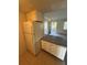 A view of the kitchen featuring cabinets and a tile backsplash at 128 Water Front Way # 300, Altamonte Springs, FL 32701