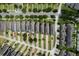 Overhead shot of a residential neighborhood featuring neatly arranged homes and tree-lined streets at 15160 Avenue Of The Arbors, Winter Garden, FL 34787