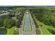 Breathtaking aerial view of a road with a scenic median leading to a grand building and lush greenery at 15160 Avenue Of The Arbors, Winter Garden, FL 34787