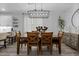 Dining room featuring a modern light fixture and hardwood floors throughout at 15160 Avenue Of The Arbors, Winter Garden, FL 34787