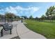 Well-maintained dog park featuring grassy areas, benches, and separate fenced zones for small and large dogs at 15160 Avenue Of The Arbors, Winter Garden, FL 34787