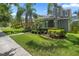Landscaped front yard with a brick walkway and lush greenery at 15160 Avenue Of The Arbors, Winter Garden, FL 34787