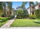 Inviting two-story home with a brick walkway and meticulously maintained front yard at 15160 Avenue Of The Arbors, Winter Garden, FL 34787