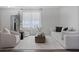 Bright living room featuring modern decor, hardwood floors, and stylish furnishings at 15160 Avenue Of The Arbors, Winter Garden, FL 34787