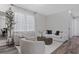 Well-lit living room boasting modern decor and hardwood floors throughout at 15160 Avenue Of The Arbors, Winter Garden, FL 34787