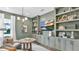 Stylish home office with custom built-ins, modern lighting, and comfortable seating at 161 Purcell Dr, Alafaya, FL 32825