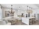 Open-concept kitchen with a large island, modern lighting, and stainless steel appliances at 161 Purcell Dr, Alafaya, FL 32825