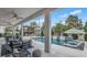 Inviting backyard pool area with covered patio and comfortable outdoor seating at 161 Purcell Dr, Alafaya, FL 32825