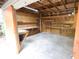 Spacious workshop interior with shelving, workbench, and concrete floor at 2302 Ashington Park Dr, Apopka, FL 32703