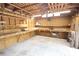 Bright workshop with wood beam ceiling, ample workbench space, and good lighting at 2302 Ashington Park Dr, Apopka, FL 32703
