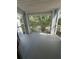 Spacious outdoor balcony offers a relaxing spot with views of mature trees at 2585 Grassy Point Dr # 313, Lake Mary, FL 32746